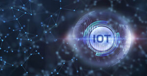 Internet of things - IOT concept. Businessman offer IOT products and solutions. Young businessman select the abstract chip with text IoT on the virtual display.